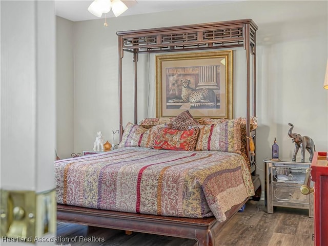 bedroom with wood finished floors