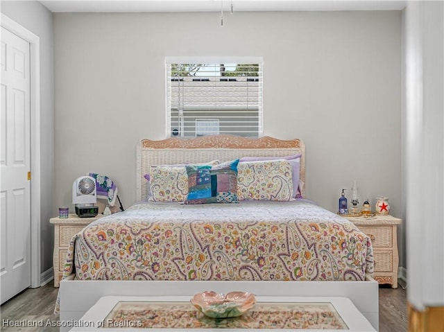 bedroom featuring wood finished floors