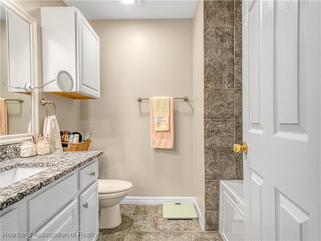 full bathroom featuring vanity, tile patterned floors, toilet, and baseboards