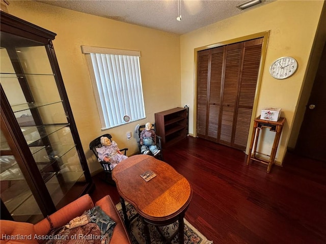 office area featuring dark hardwood / wood-style floors and a textured ceiling