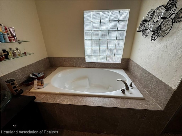 bathroom featuring tiled bath