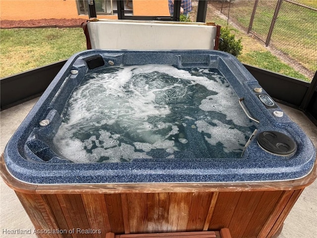 exterior details with a hot tub