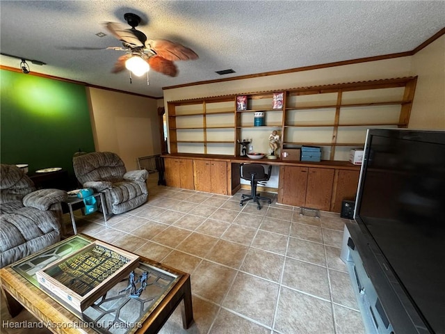 office with crown molding, built in desk, a textured ceiling, and light tile patterned floors