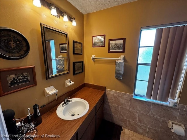 bathroom with vanity and a textured ceiling