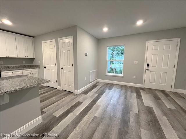 interior space featuring dark hardwood / wood-style flooring