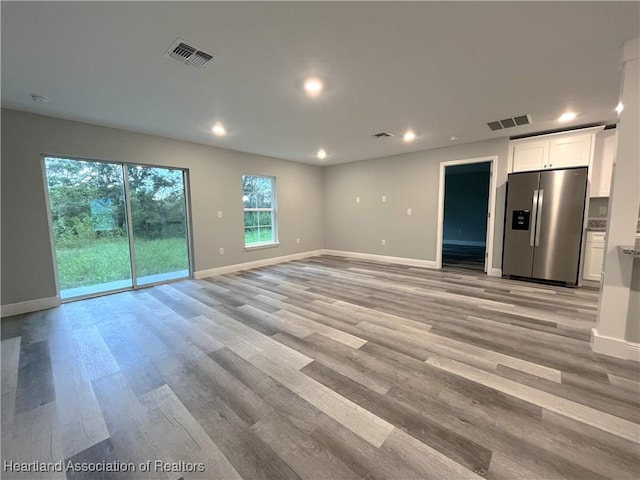 unfurnished living room with light wood-type flooring