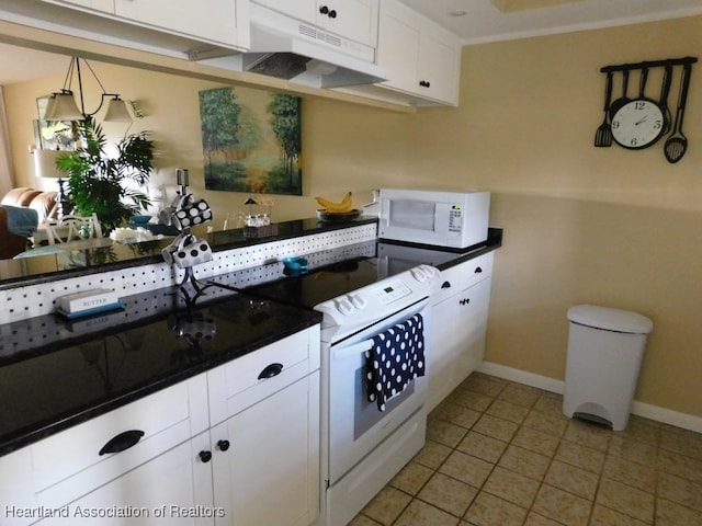 3513 Edgewater Dr, Sebring, FL 33872 - kitchen featuring dark countertops, white appliances, under cabinet range hood, and white cabinets