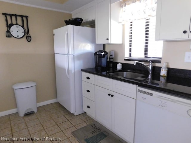 3513 Edgewater Dr, Sebring, FL 33872 - kitchen with dark countertops, white cabinetry, a sink, white appliances, and baseboards