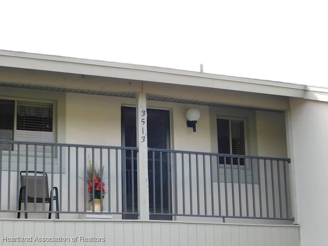 property entrance with stucco siding