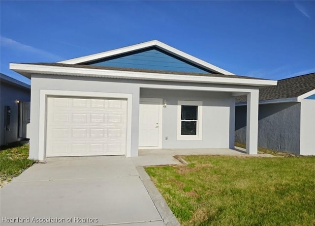 ranch-style house featuring a garage, driveway, stucco siding, and a front lawn