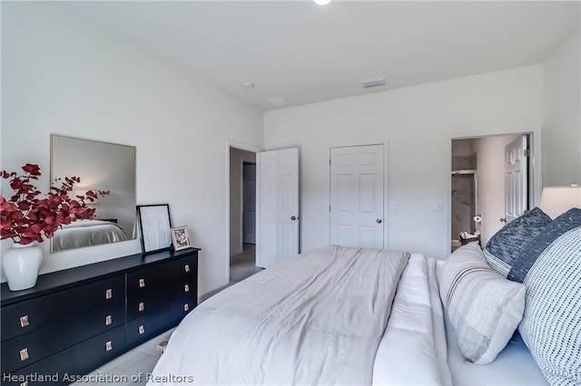 bedroom featuring visible vents
