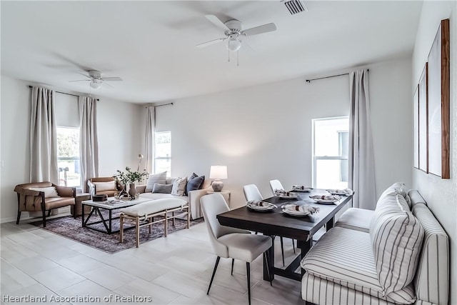 dining room featuring ceiling fan and visible vents