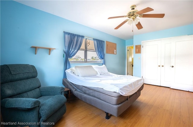 bedroom featuring a closet, ceiling fan, and wood finished floors