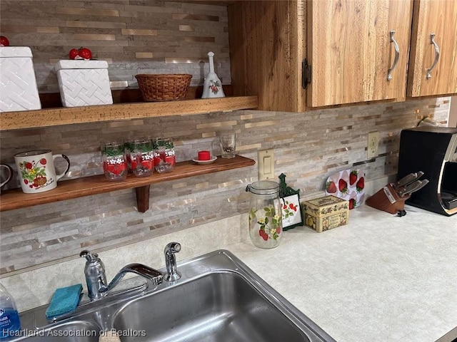 kitchen with decorative backsplash and sink