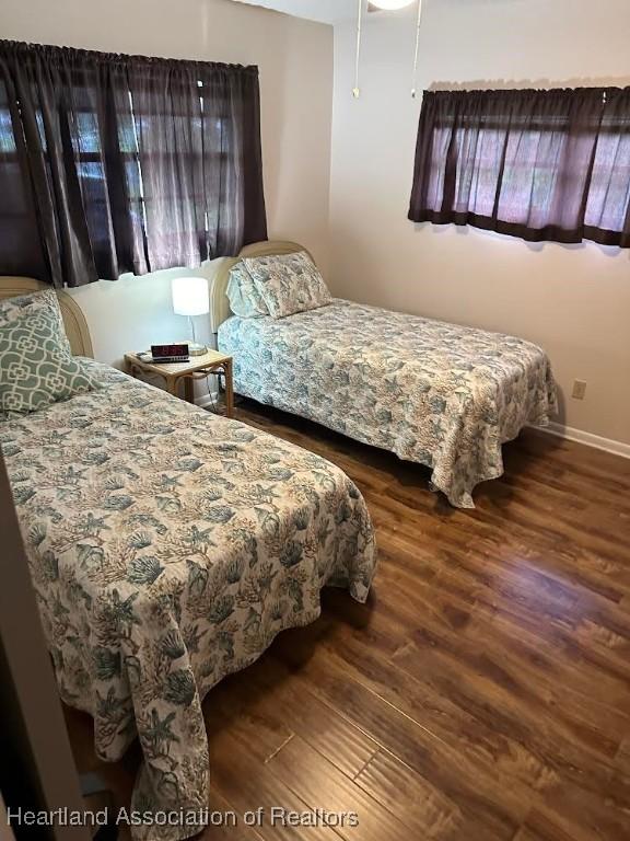 bedroom featuring dark hardwood / wood-style flooring