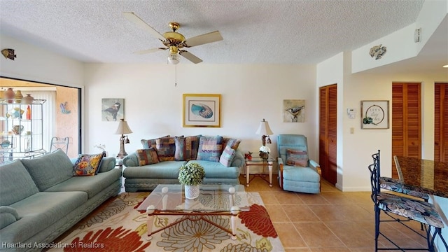 4701 Casablanca Cir Unit B5, Sebring, FL 33870 - living area with ceiling fan, tile patterned flooring, baseboards, and a textured ceiling