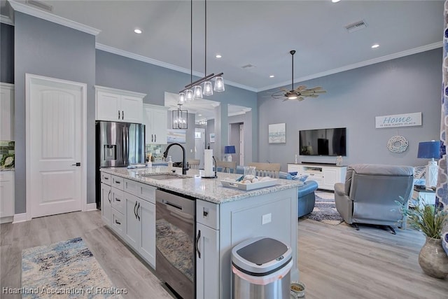 kitchen featuring white cabinets, dishwasher, a sink, visible vents, and a ceiling fan