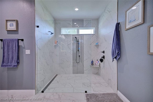 bathroom with recessed lighting, marble finish floor, a walk in shower, and baseboards