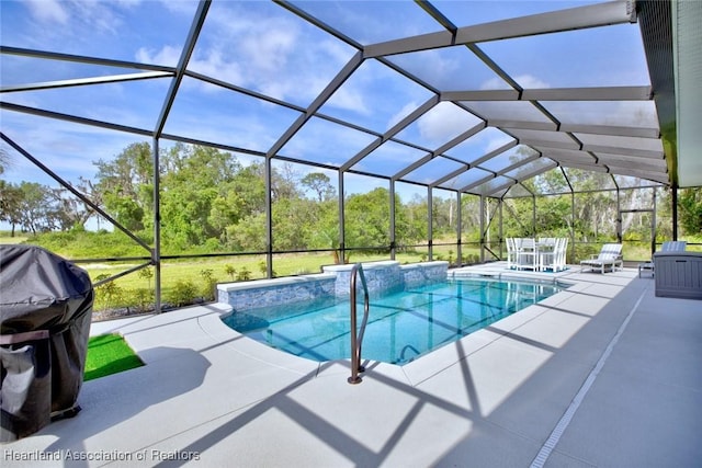 pool with a patio and a lanai