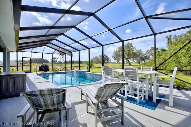 outdoor pool featuring a lanai and a patio