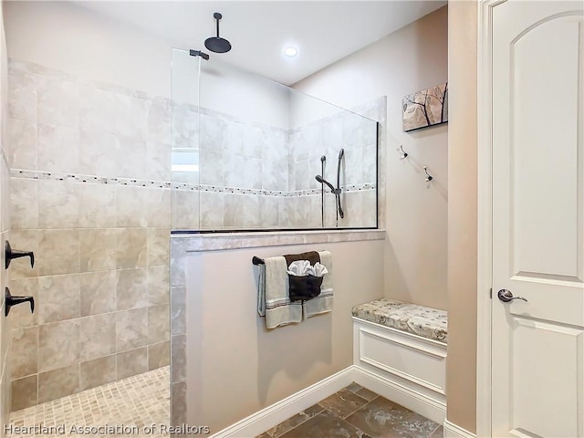 bathroom with tiled shower