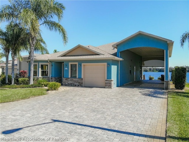 view of front of house with a garage and a carport