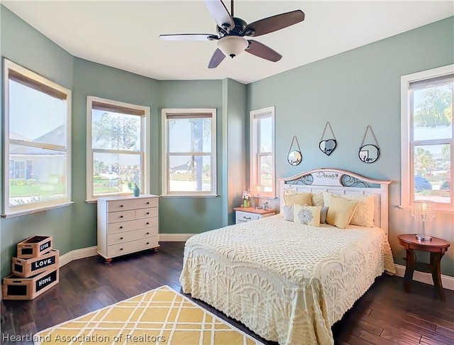 bedroom featuring dark hardwood / wood-style flooring and ceiling fan