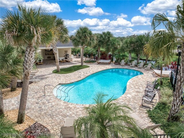 35145 Daily Dr, Sebring, FL 33872 - view of swimming pool with a patio
