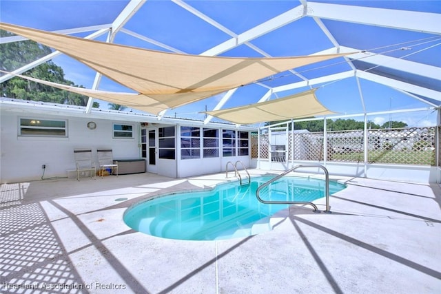 1644 Heron Dr S, Lorida, FL 33857 - view of pool featuring glass enclosure, a patio area, and a sunroom