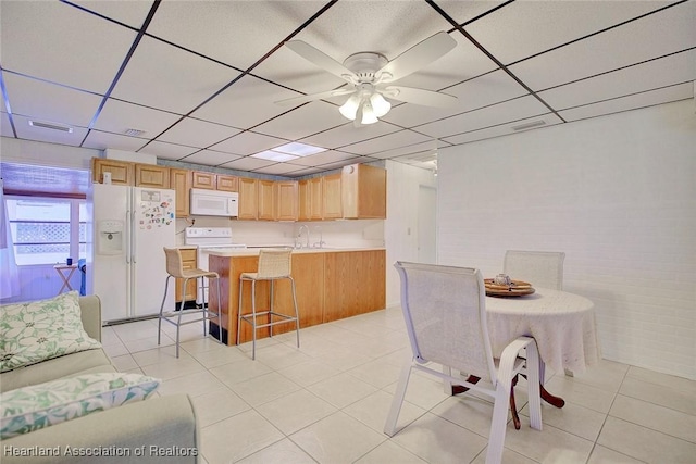 1644 Heron Dr S, Lorida, FL 33857 - tiled dining room featuring ceiling fan and sink