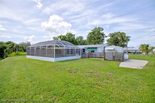 1644 Heron Dr S, Lorida, FL 33857 - back of house with a lawn