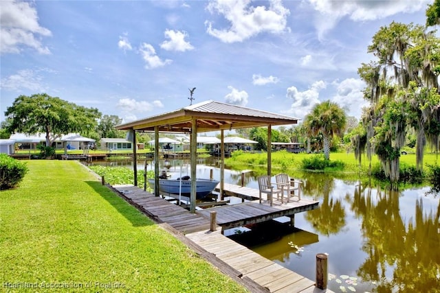 1644 Heron Dr S, Lorida, FL 33857 - view of dock with a water view and a lawn