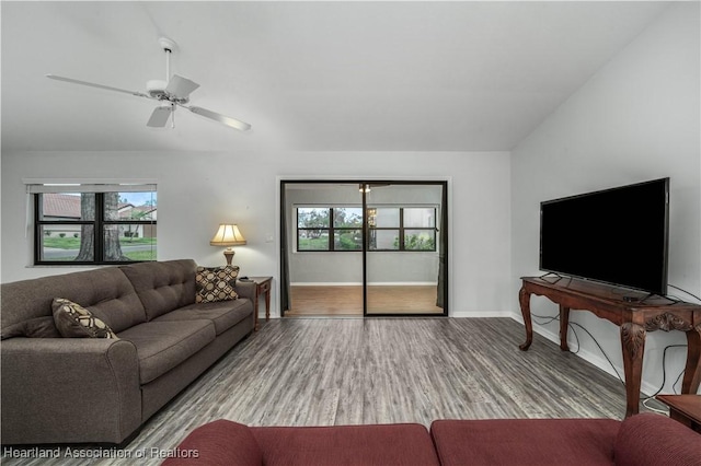 living room featuring ceiling fan and light hardwood / wood-style floors