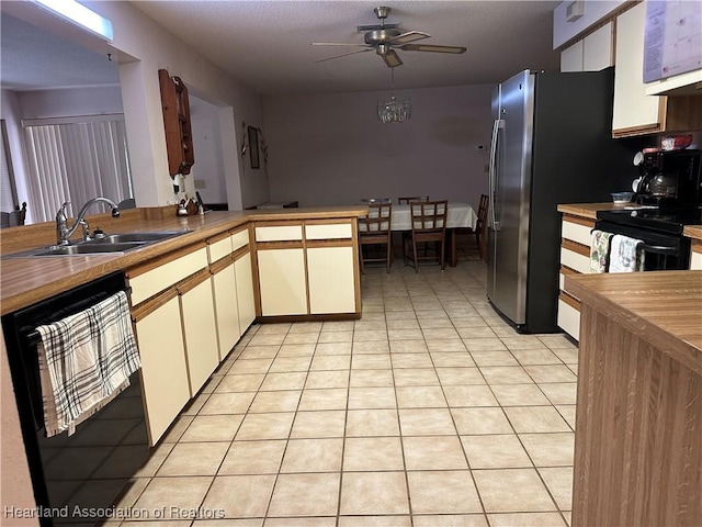 kitchen with ceiling fan, light tile patterned floors, dishwasher, a sink, and butcher block countertops