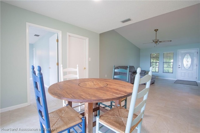 dining space with vaulted ceiling and ceiling fan