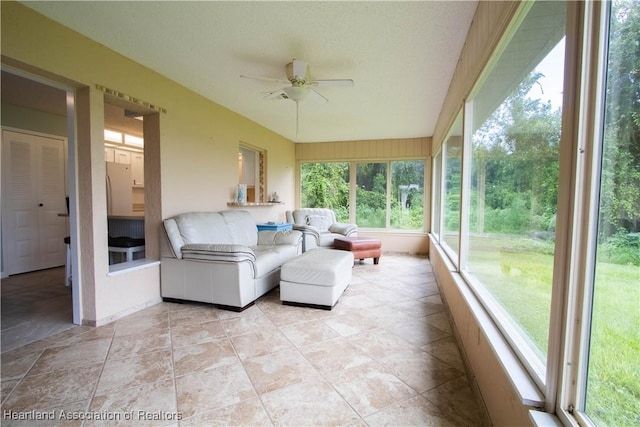 sunroom / solarium with ceiling fan