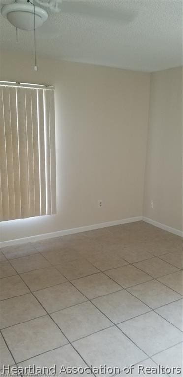 unfurnished room featuring light tile patterned floors