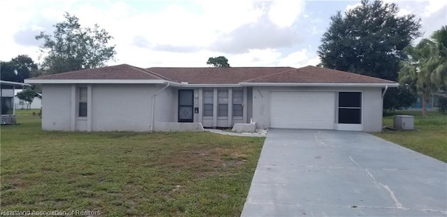 ranch-style home with a front lawn and a garage