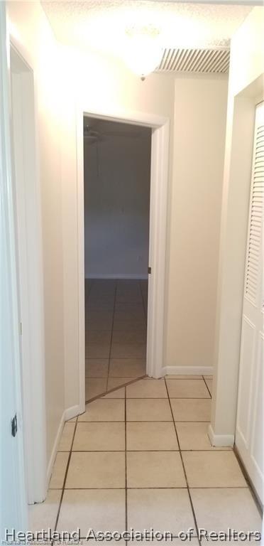 hallway featuring tile patterned floors