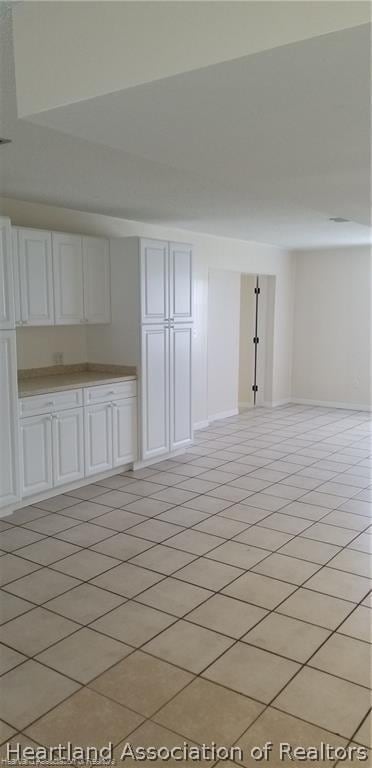 interior space featuring light tile patterned floors