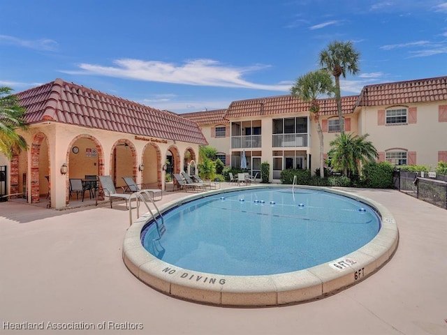 view of pool with a patio