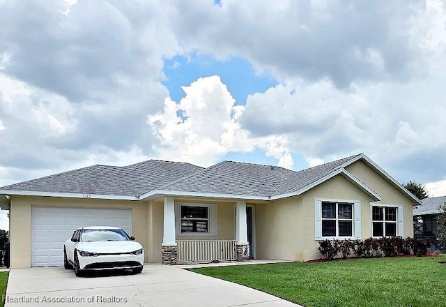132 Red Water Pt, Lake Placid, FL 33852 - ranch-style house with driveway, stucco siding, an attached garage, and a front lawn