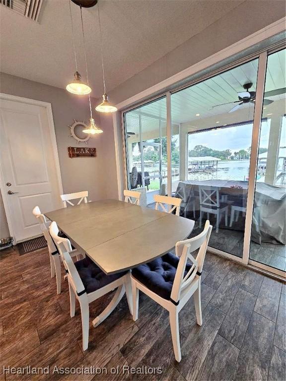 132 Red Water Pt, Lake Placid, FL 33852 - dining space featuring dark wood finished floors and ceiling fan