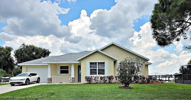 132 Red Water Pt, Lake Placid, FL 33852 - view of front of home featuring an attached garage, stucco siding, a front yard, and concrete driveway