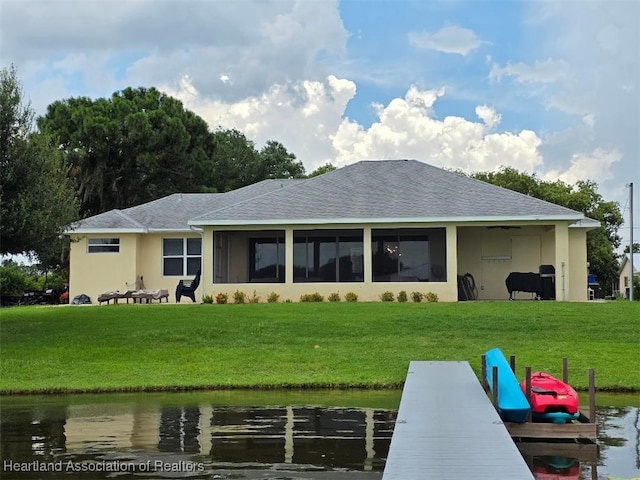 132 Red Water Pt, Lake Placid, FL 33852 - rear view of property featuring a lawn, a water view, a shingled roof, and stucco siding