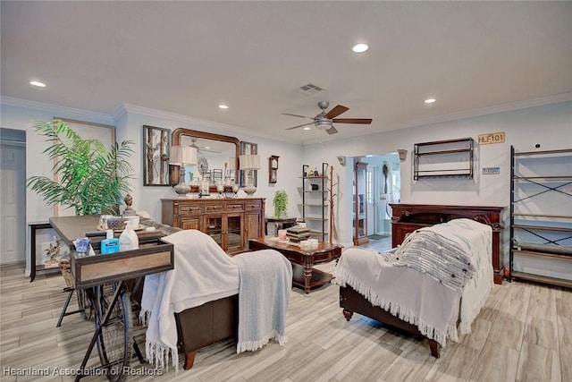 living room with ceiling fan and ornamental molding