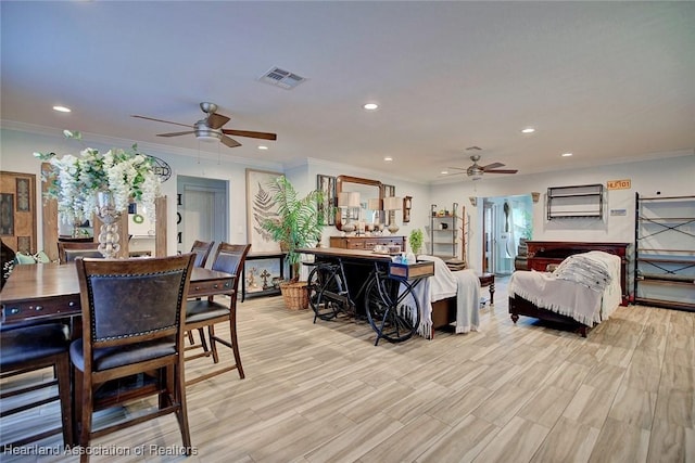 dining area featuring ceiling fan, light hardwood / wood-style floors, and ornamental molding