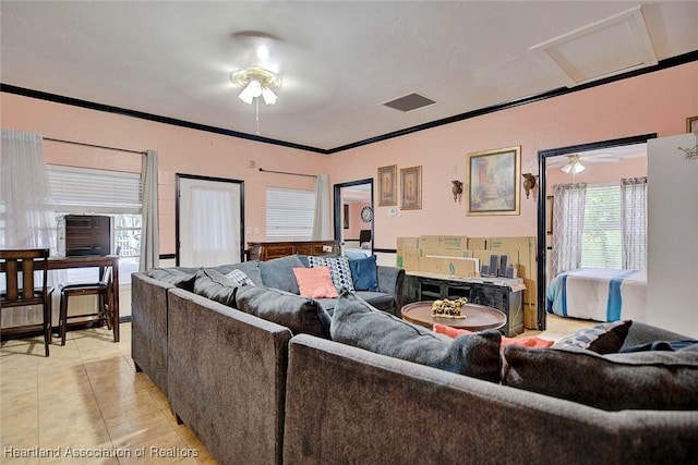 tiled living room featuring crown molding