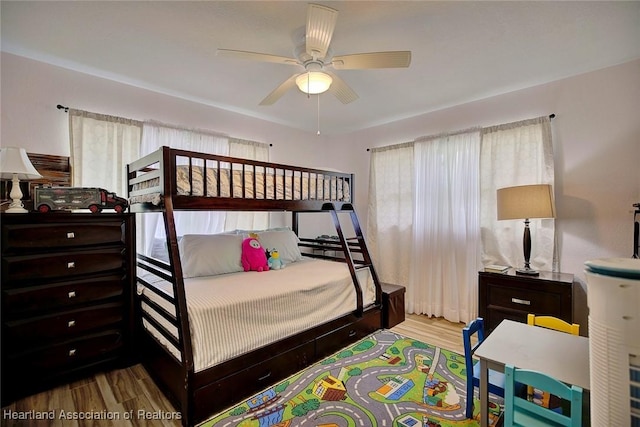 bedroom with ceiling fan and hardwood / wood-style floors