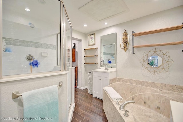 bathroom featuring plus walk in shower and vanity